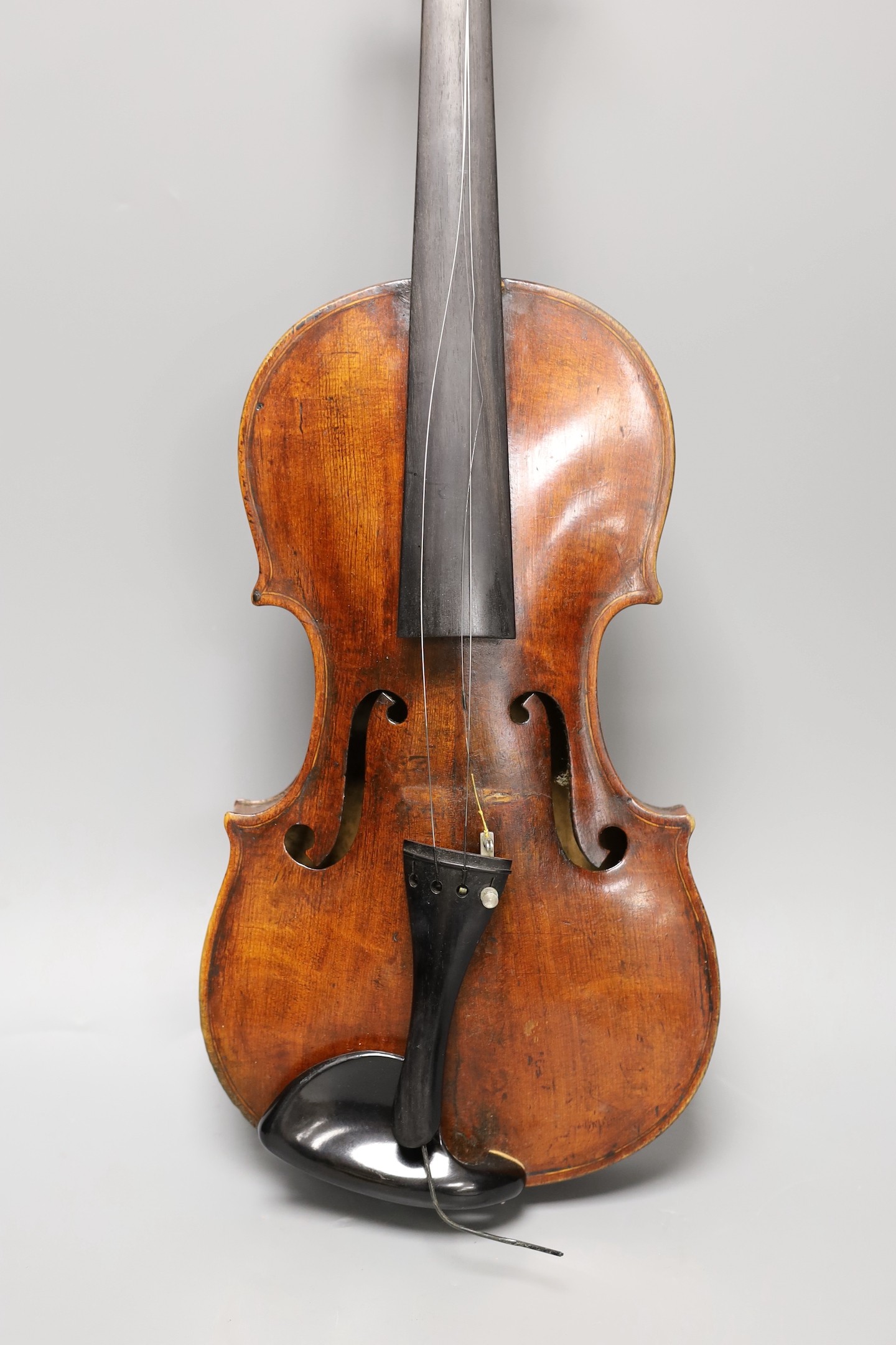 A violin labelled 'Albani Palermo', cased, length of back 35.5cm